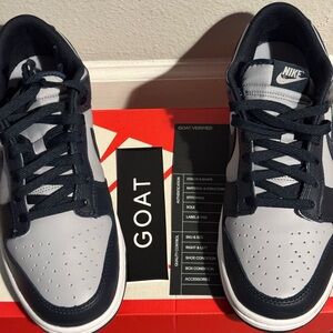 Nike Men's Dunk Low Retro wolf grey and obsidian blue.